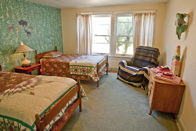 Two twin beds in a spacious double room.