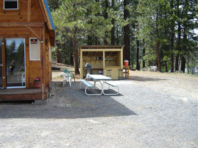 Side view of the cabin including the outdoor cook shed