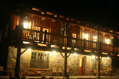 Beautifully lit up at night, front porch